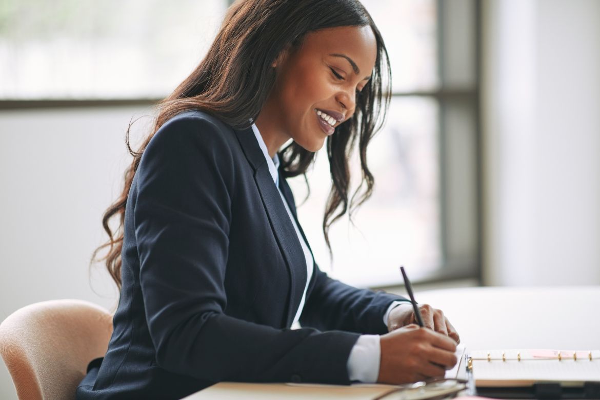 lawyer writing at desk