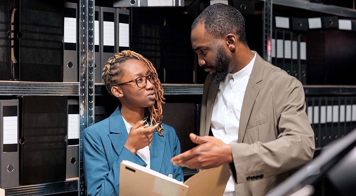 Male and female looking at a file