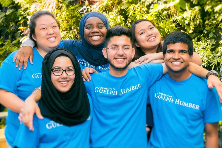 Group of students wearing UofGH t-shirts