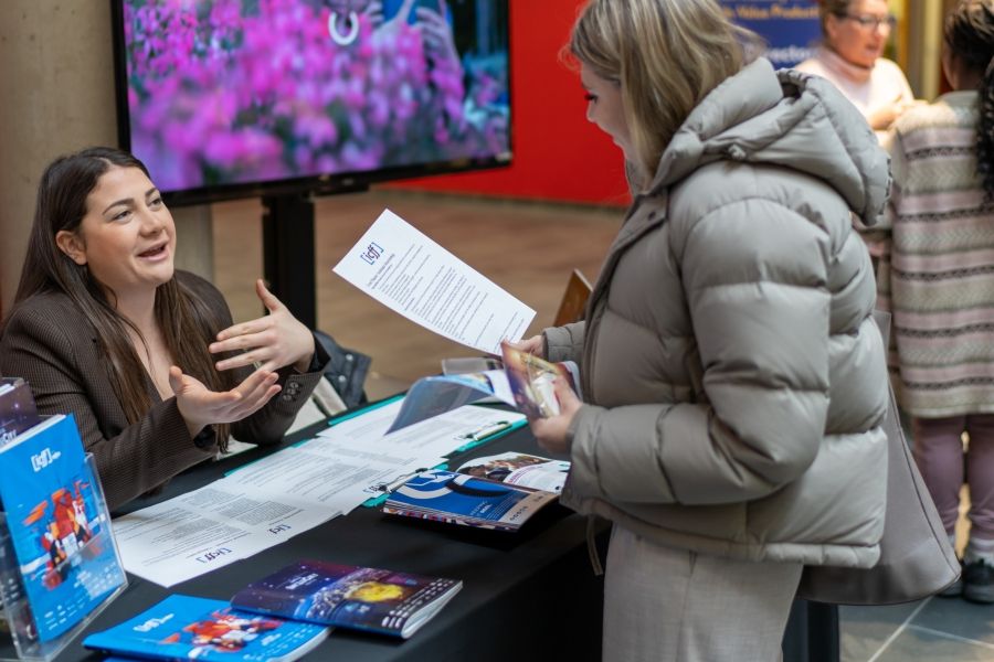 Student speaking to an employer partner at a career fair