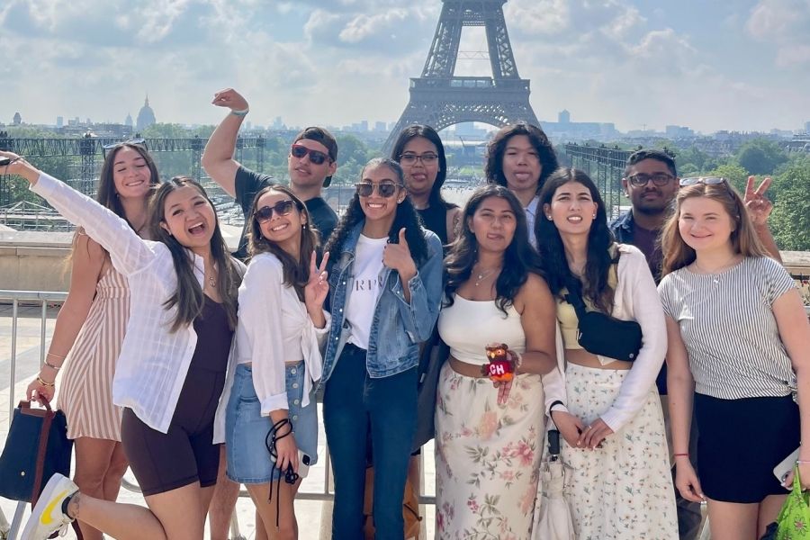 A group of students with the Eiffel Tower in the background