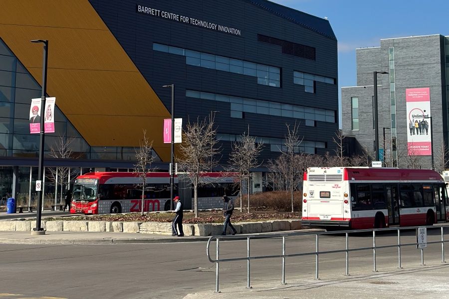 Bus loop outside the Barrett Centre for Technology and Innovation with two buses