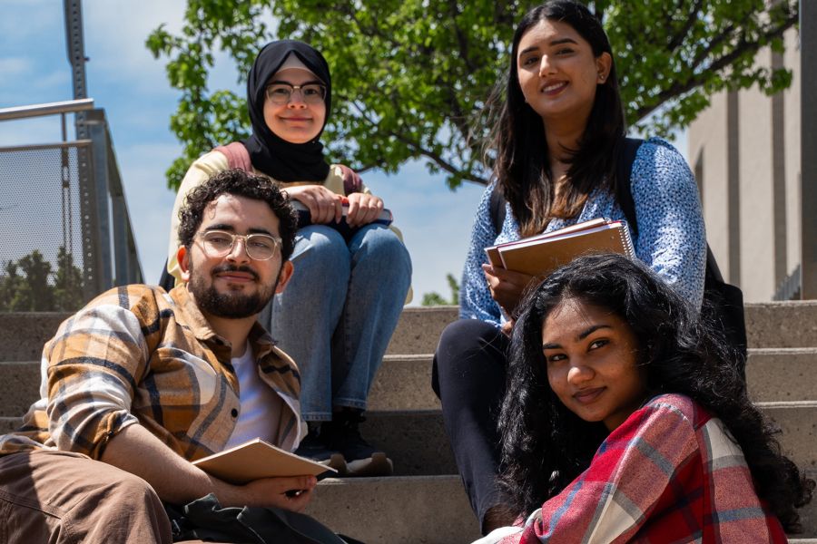 Four students on stairs