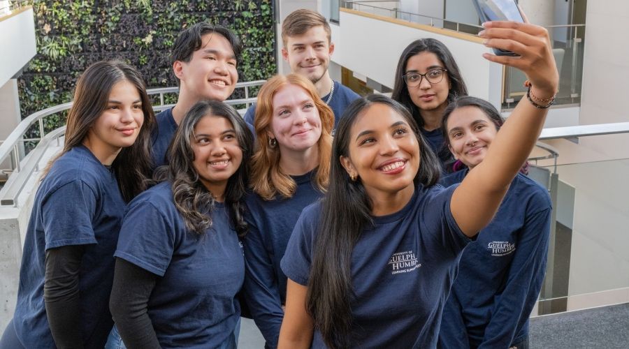Group of students taking a group selfie