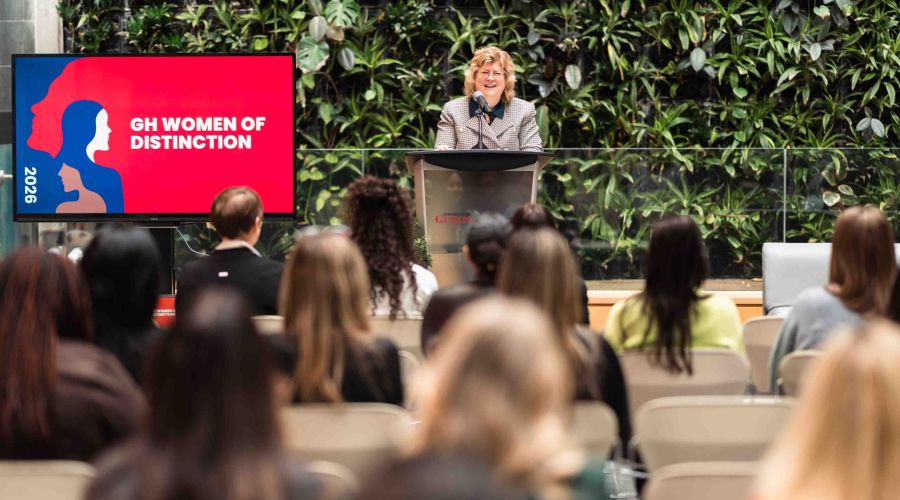 Woman speaking to crowd from podium