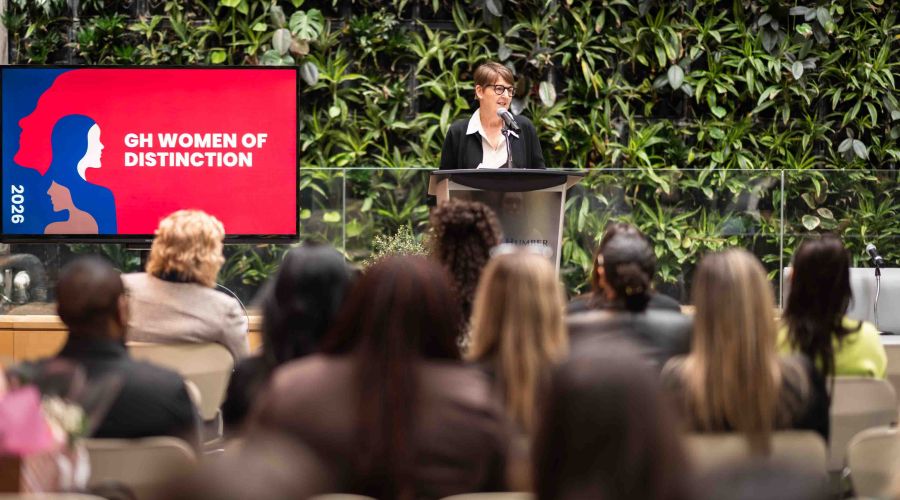 Woman speaking to crowd from podium