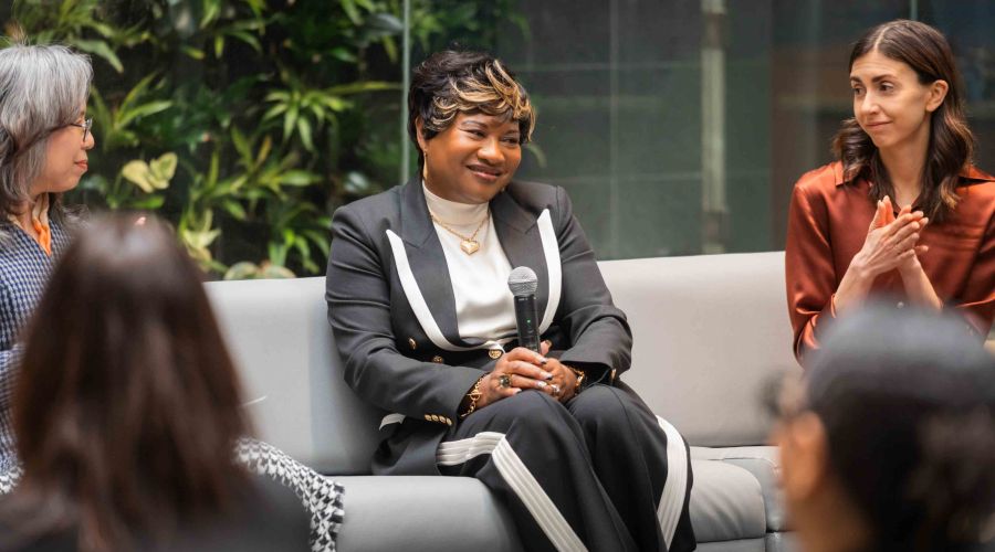 Three women on a couch for panel discussion